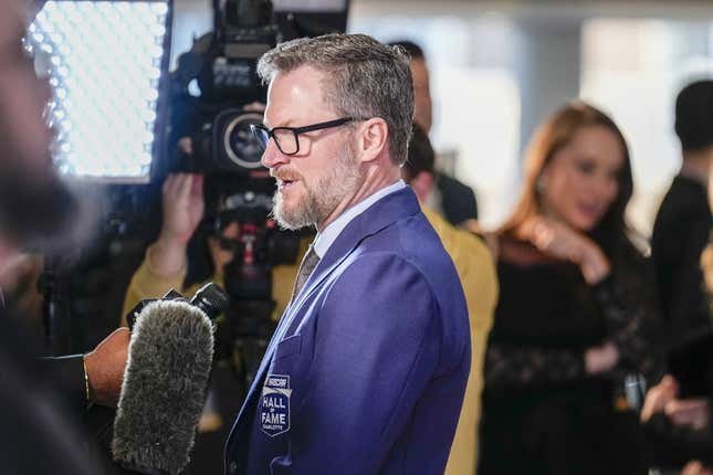 Jan 19, 2024; Charlotte, NC, USA; Dale Earnhardt Jr. talks to interviewers during the red carpet at Charlotte Convention Center Crown Ballroom.