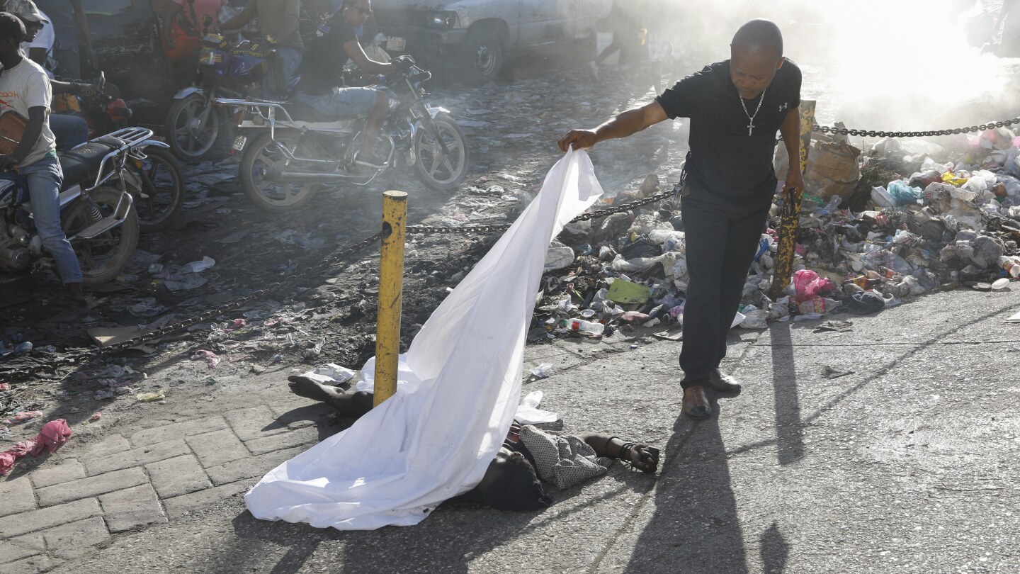 gangs-unleash-new-attacks-on-upscale-areas-in-haiti’s-capital,-with-at-least-a-dozen-killed-nearby