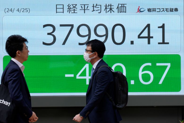 stock-market-today:-asian-benchmarks-mostly-slide-as-investors-focus-on-earnings