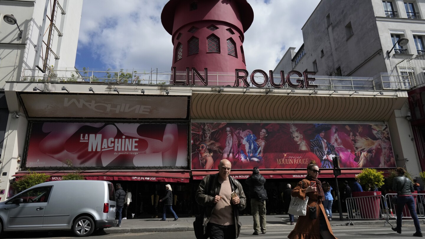 the-windmill-sails-at-paris’-iconic-moulin-rouge-have-collapsed.-no-injuries-are-reported