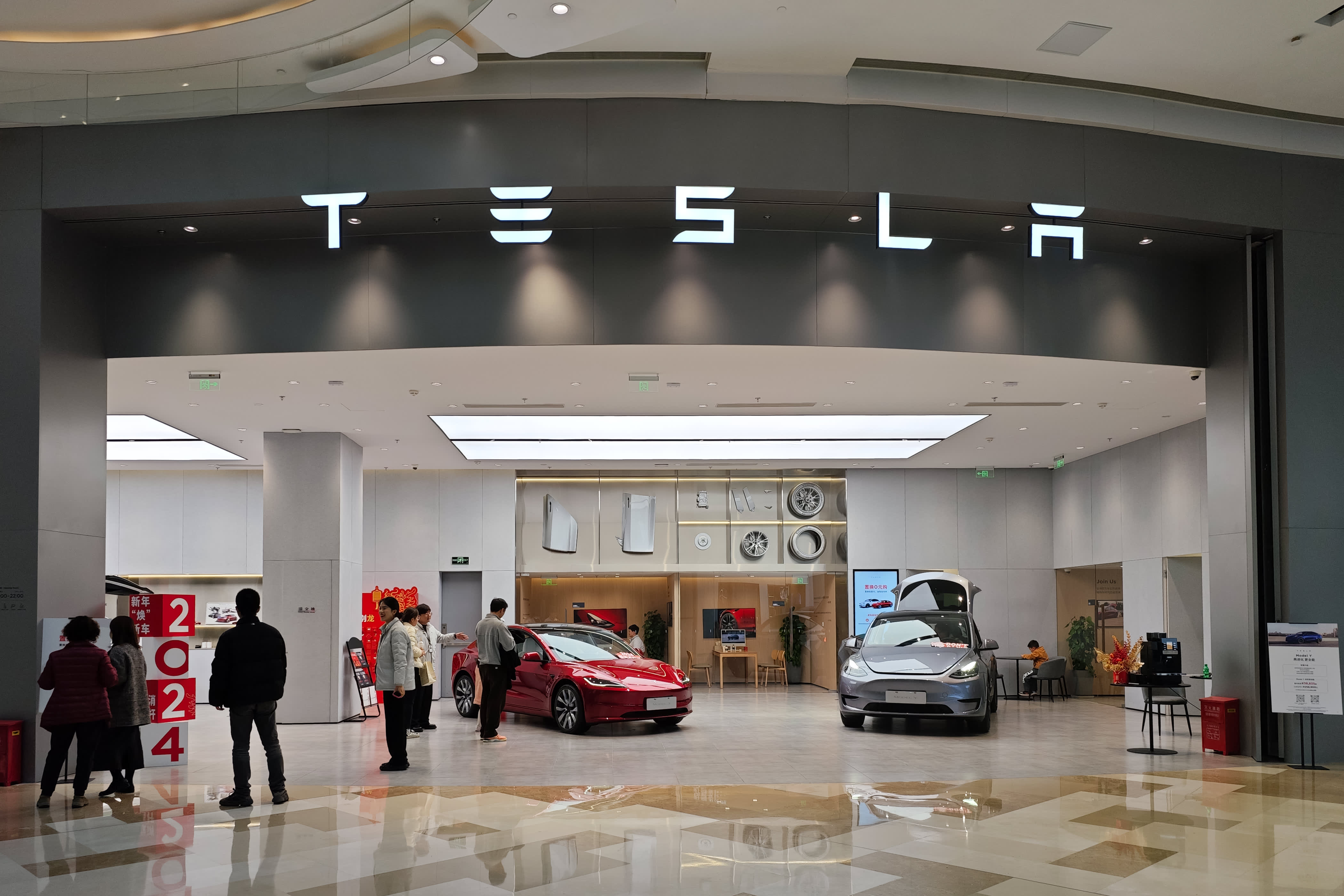 People are shopping at a Tesla store in Shanghai, China, on Feb. 17, 2024.