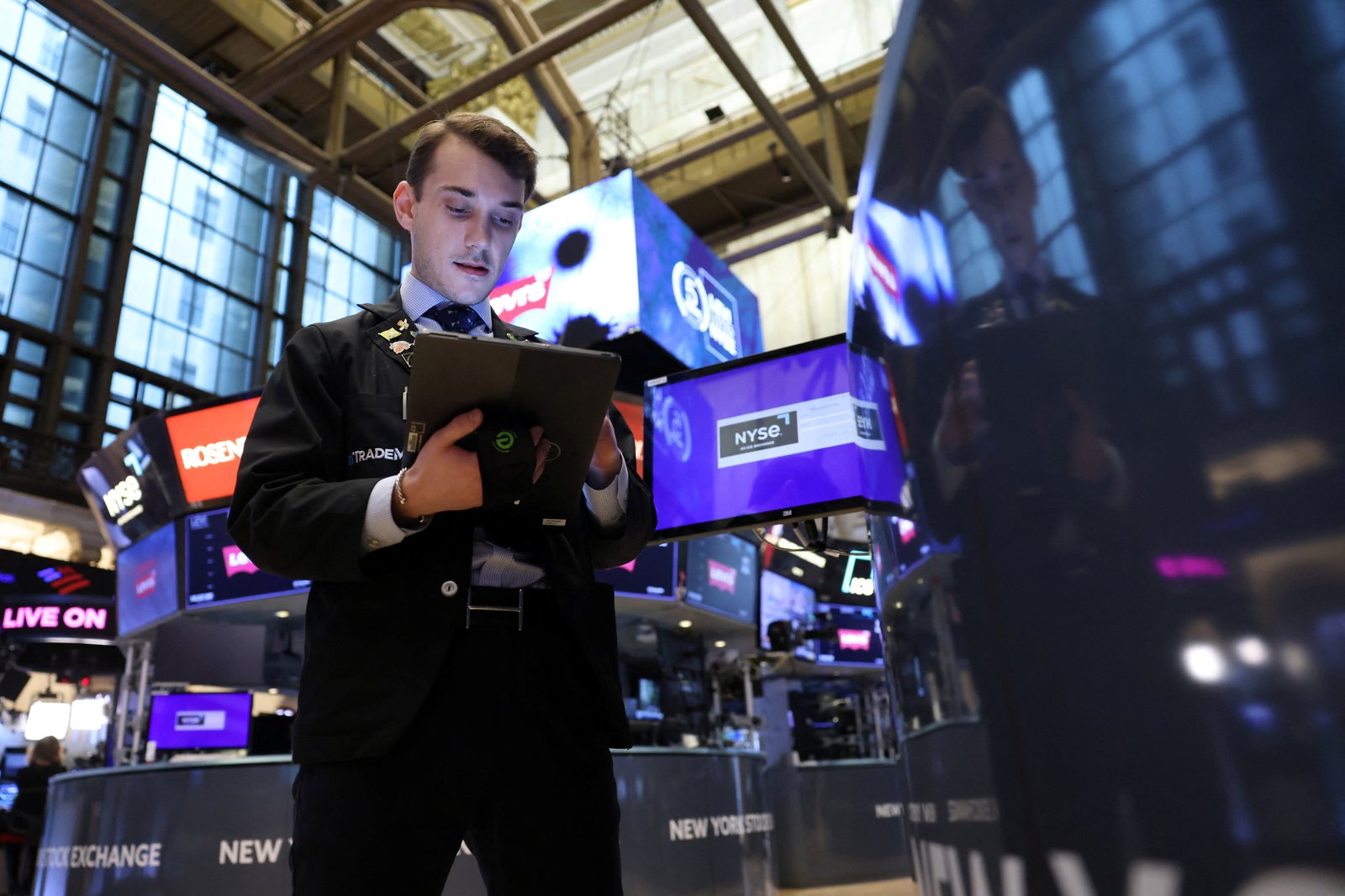 A trader works on the trading floor at the New York Stock Exchange (NYSE) in New York City