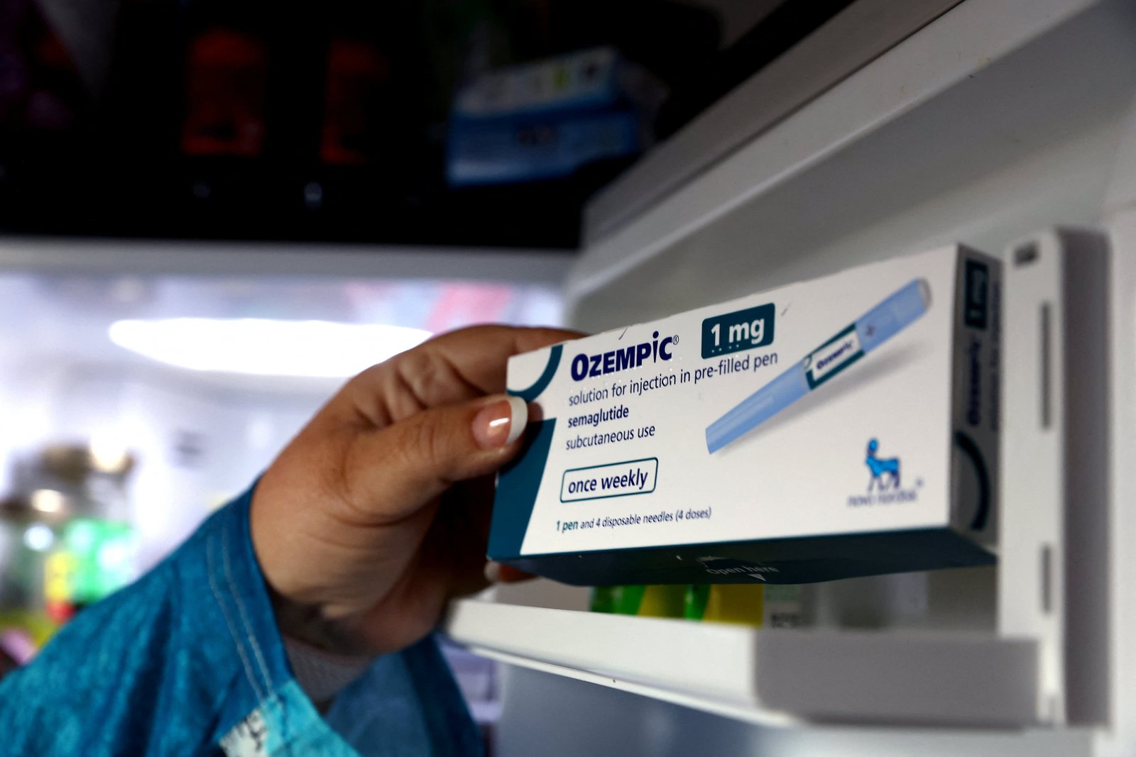 Kim Gradwell with an Ozempic injection needle at her home in Dudley, North Tyneside, Britain, October 31, 2023. 