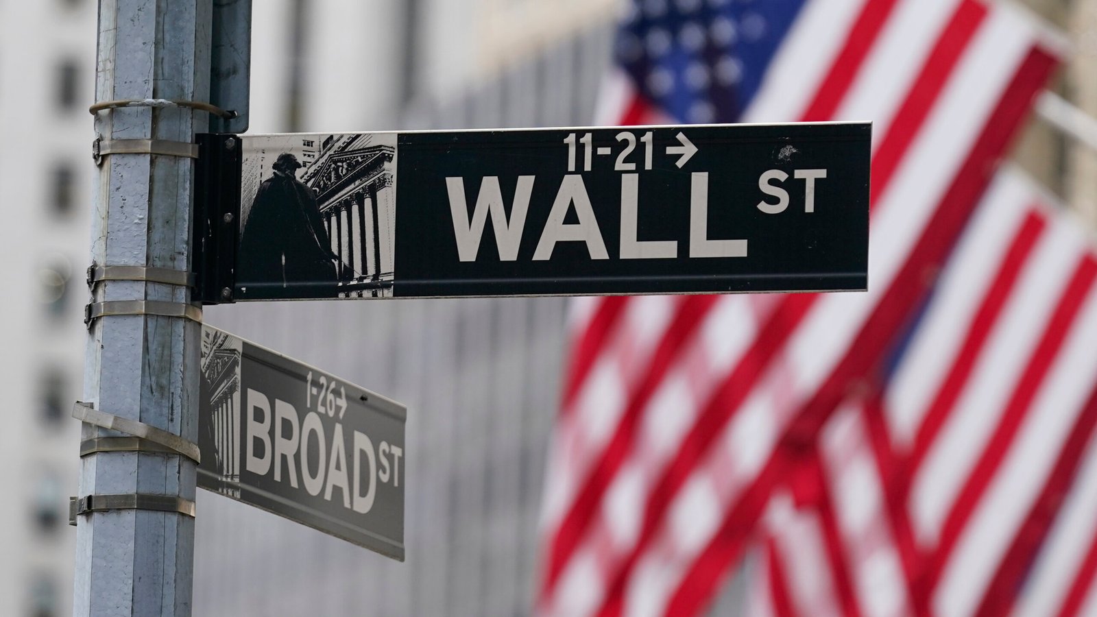 FILE - A street sign is seen in front of the New York Stock Exchange June 14, 2022. The U.S. stock ...
