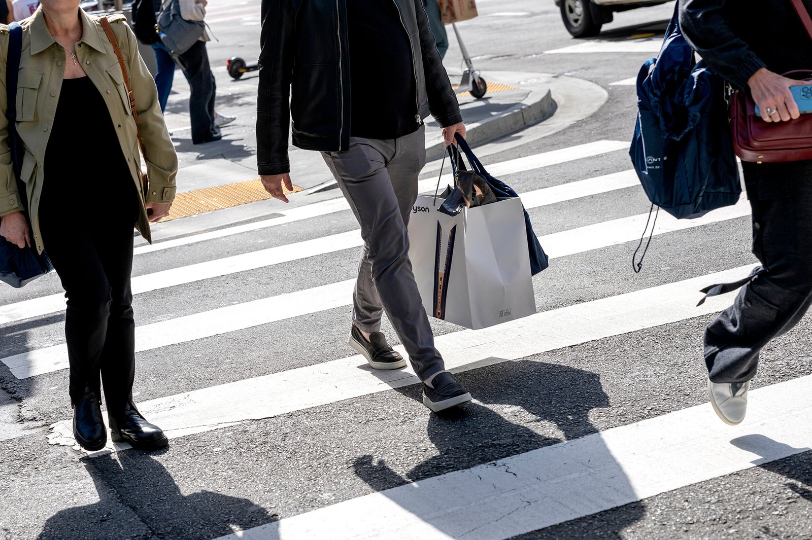 A shopper carries shopping bags in San Francisco, California, on June 7.