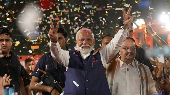 Stock market crash: Prime Minister Narendra Modi greets party workers upon his arrival for a meeting at the party headquarters in New Delhi.(PTI)