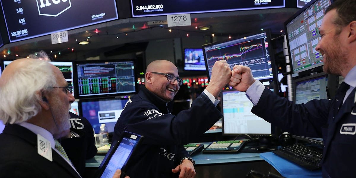 stock-market-today:-stocks-close-at-records-as-powell-strikes-dovish-tone-and-tesla-shares-spike