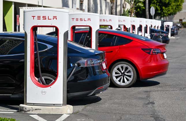 Drivers charge their Teslas in Santa Ana, CA, on Wednesday, March 20, 2024. 