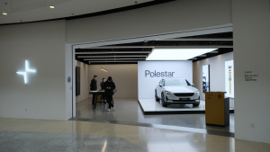 PSNY stock: Polestar EV store. Electric car and Chinese customer in store. Polestar is a Swedish automotive brand owned by Volvo Cars and Geely (GGPI). Polestar stock