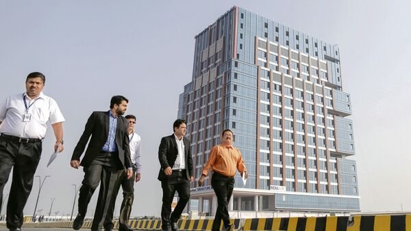 Latest news on August 20, 2024: Pedestrians walk along a road near the India International Exchange (INDIA INX) building in Gujarat International Finance Tec-City (GIFT City), Gujarat, India Photographer: Dhiraj Singh/Bloomberg (Photo: Courtesy Prabhudas Lilladher)