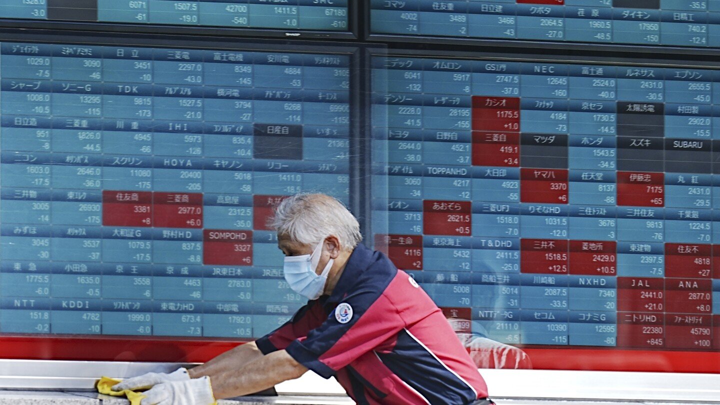 asian-benchmarks-are-mixed-in-cautious-trading-ahead-of-us-holiday,-jobs-report