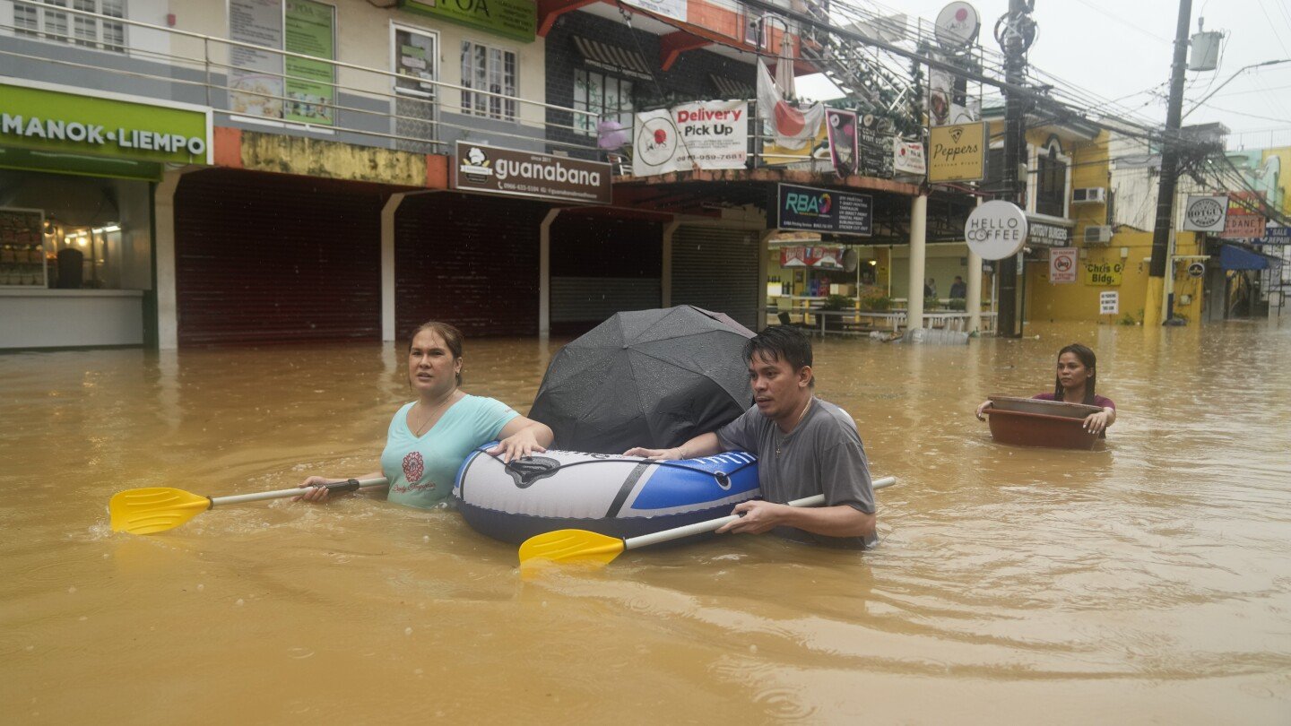 storm-floods-northern-philippine-regions,-including-capital,-disrupting-schools,-work-and-travel