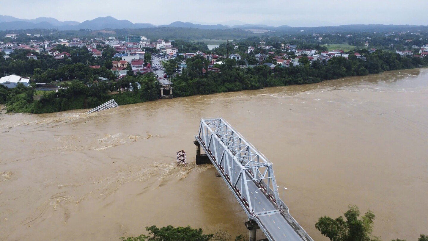 bridge-collapses-as-more-rain-falls-in-vietnam-and-storm-deaths-rise-to-21
