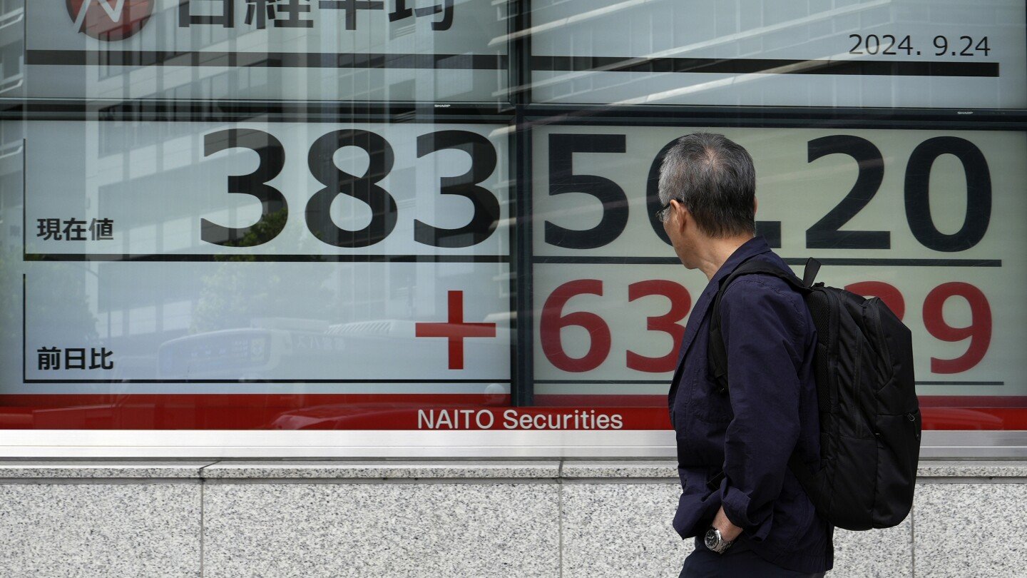 stock-market-today:-asian-shares-gain-as-china-eases-rates-to-aid-property-industry