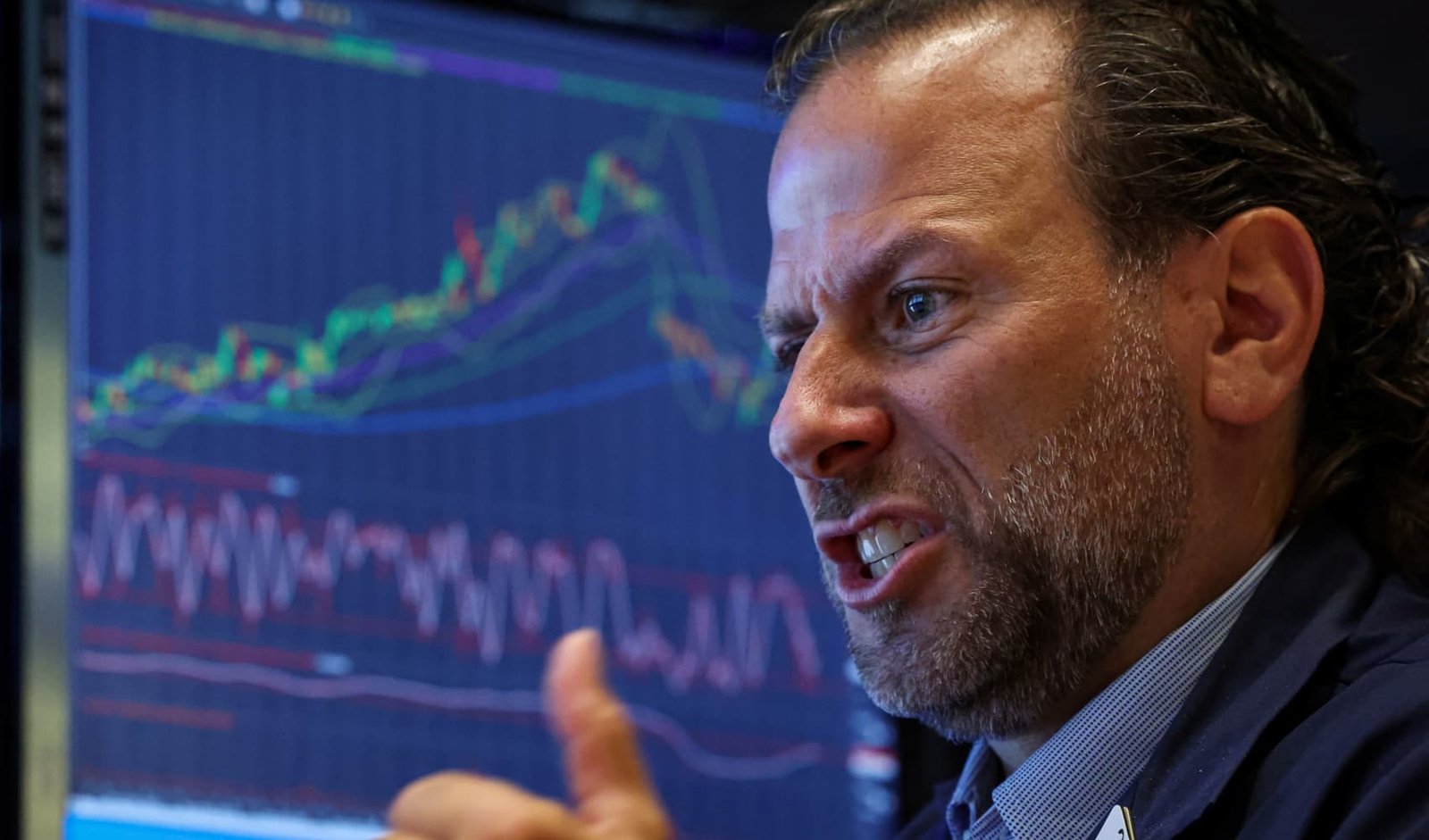 Traders work on the floor at the New York Stock Exchange (NYSE) in New York City, U.S., August 30, 2024. 