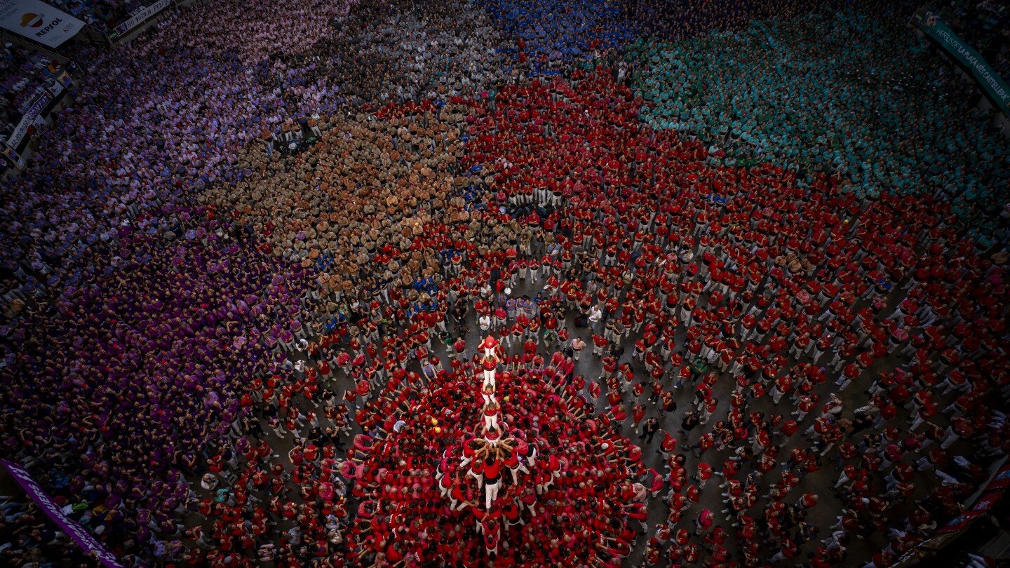 ap-photos:-human-towers-rise-skyward-in-spain’s-catalonia-as-part-of-cultural-pride