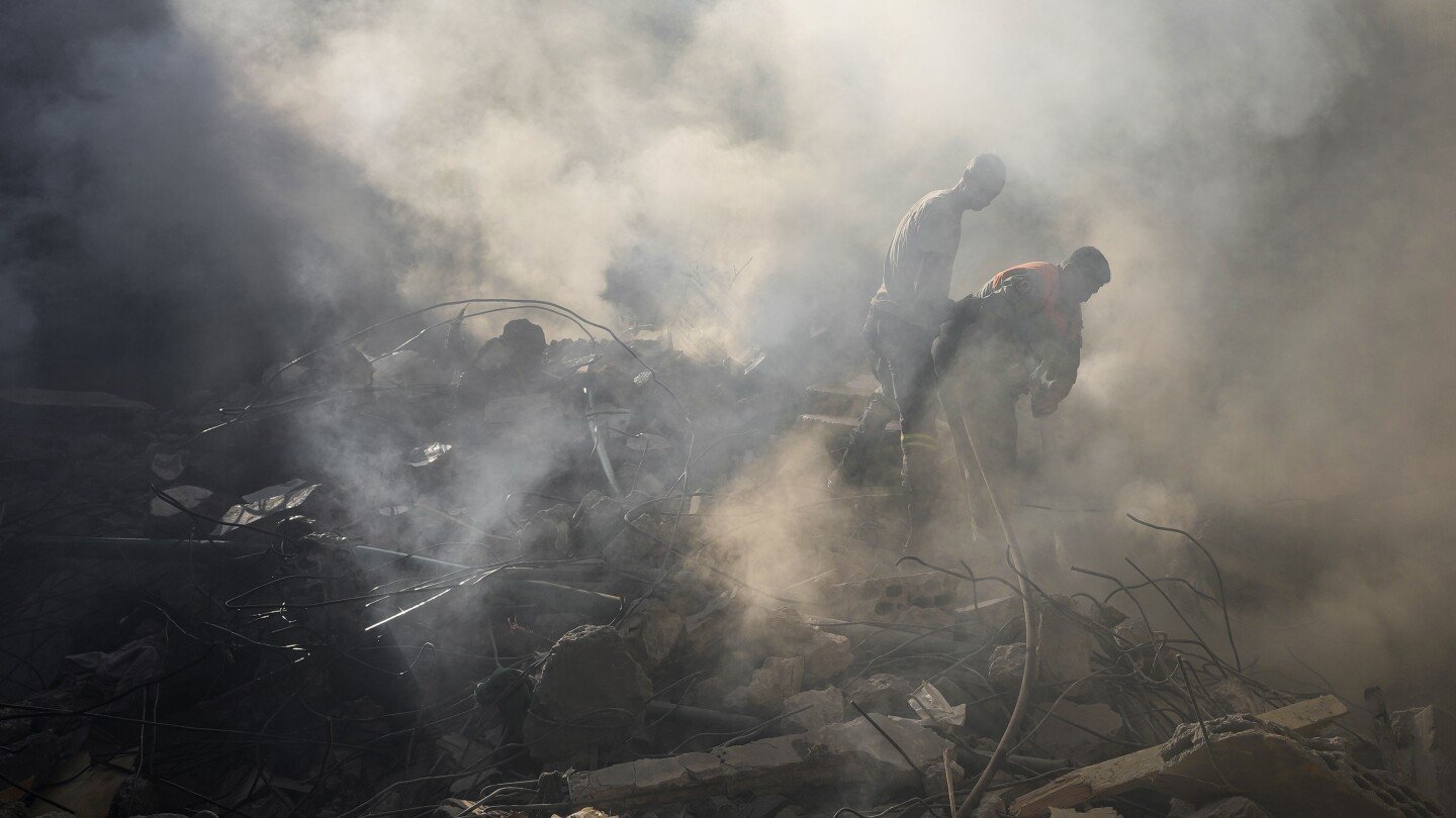 israel’s-deadliest-strike-in-central-beirut-leaves-lebanese-stunned-as-they-dig-through-the-rubble
