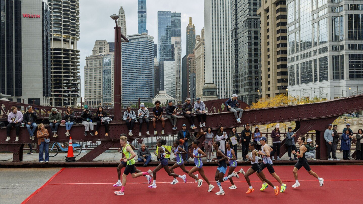 ruth-chepngetich-of-kenya-smashes-world-record-by-nearly-2-minutes-at-chicago-marathon