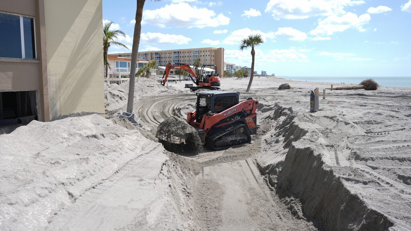 florida-digs-out-of-mountains-of-sand-swept-in-by-back-to-back-hurricanes