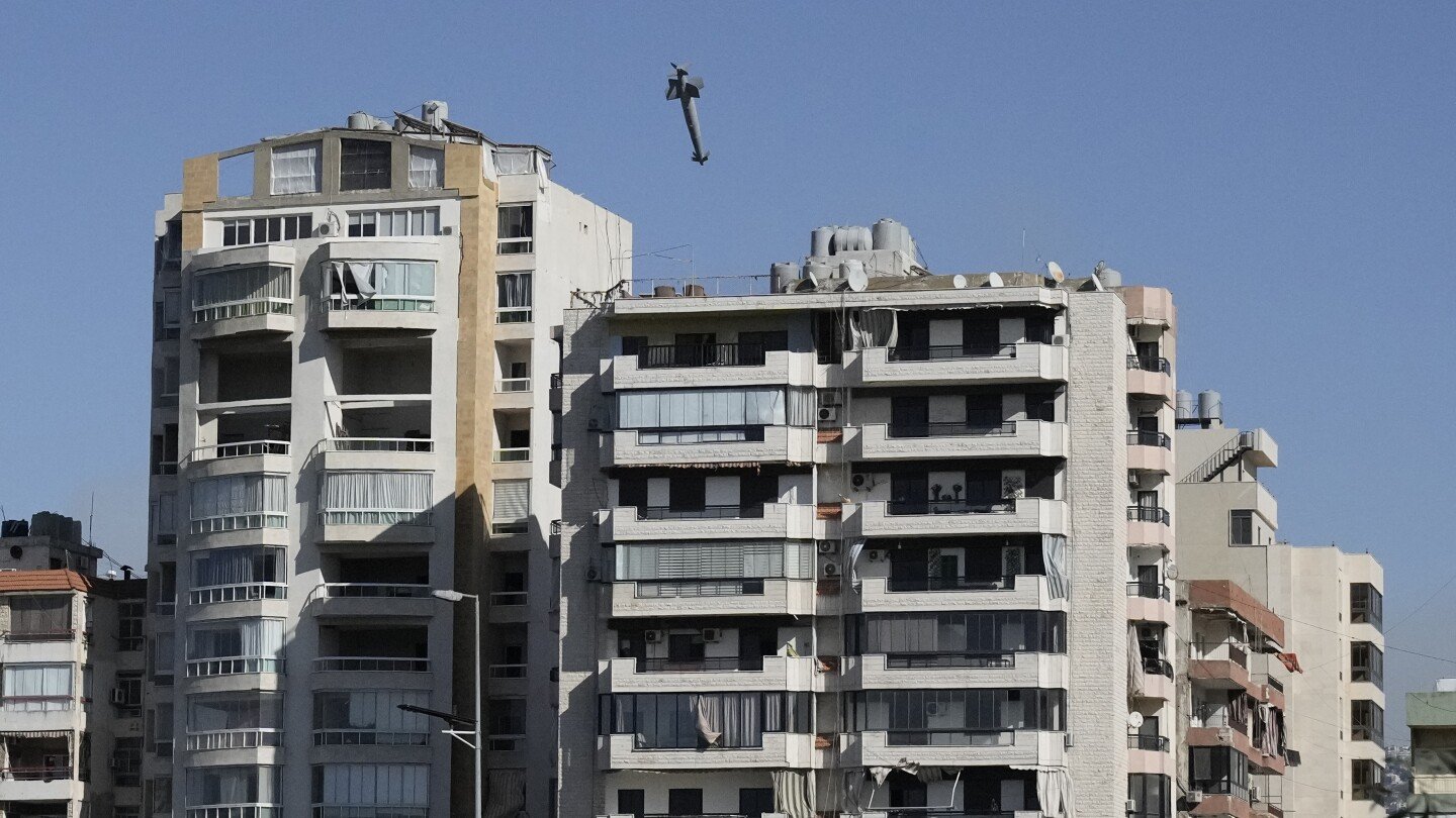 ap-photos:-images-capture-exact-moments-an-israeli-missile-strikes-building-in-beirut