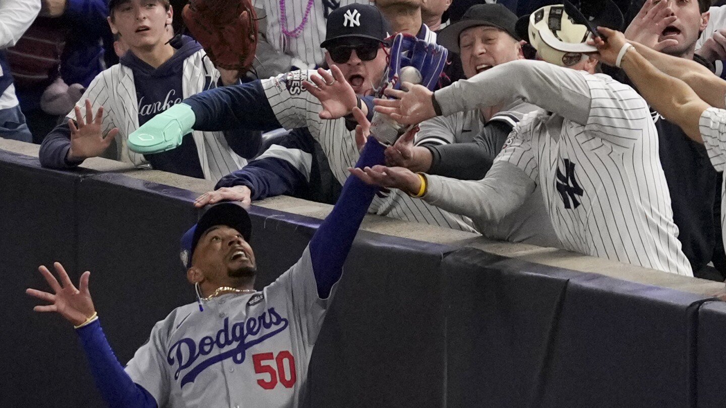 yankee-stadium-fan-ejected-for-prying-ball-out-of-mookie-betts’-glove-at-world-series