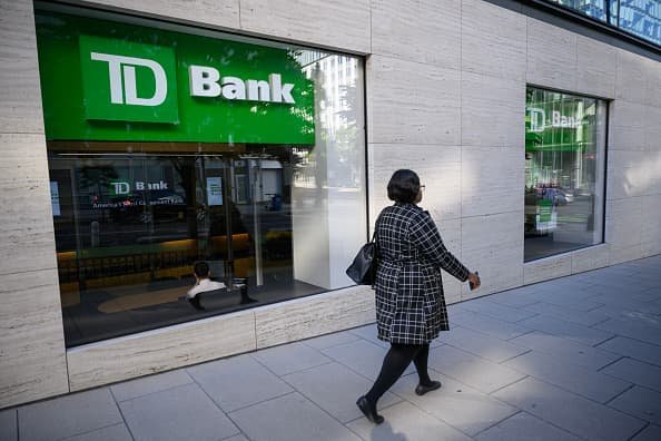 A pedestrian passes by a TD Bank branch in Washington, DC on October 10, 2024. 