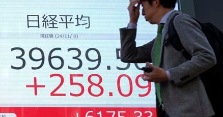 stock-market-today:-asian-shares-gain-after-us-fed-cuts-interest-rates