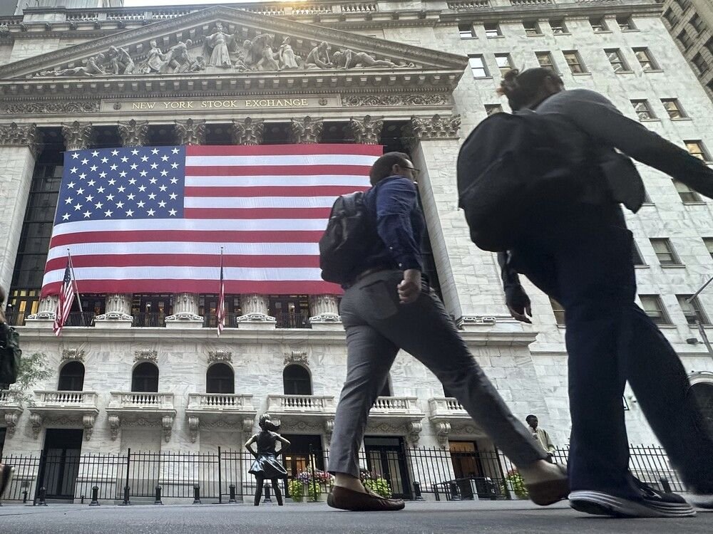 The American flag hangs from the front of the New York Stock Exchange on Sept. 10, 2024, in New York.