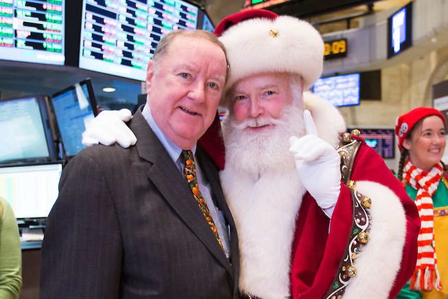 Art Cashin with Santa Claus on the floor of the NYSE in 2013.