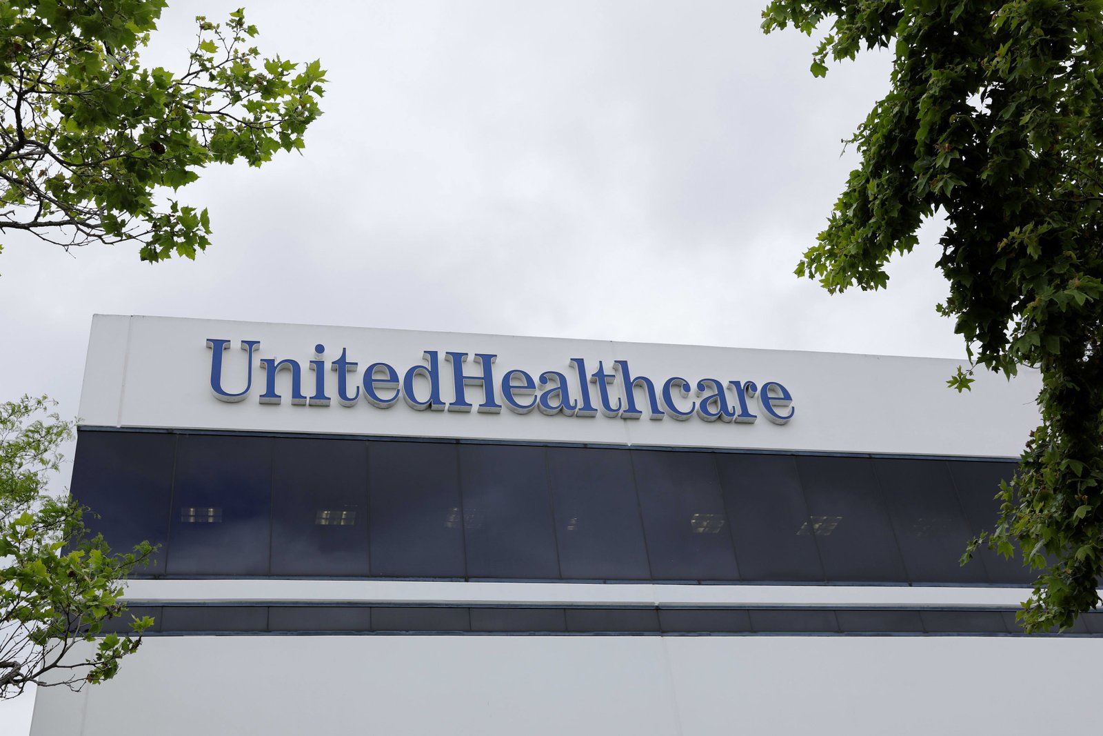 The logo of UnitedHealth appears on the side of one of its office buildings in Santa Ana, California, on April 13, 2020.
