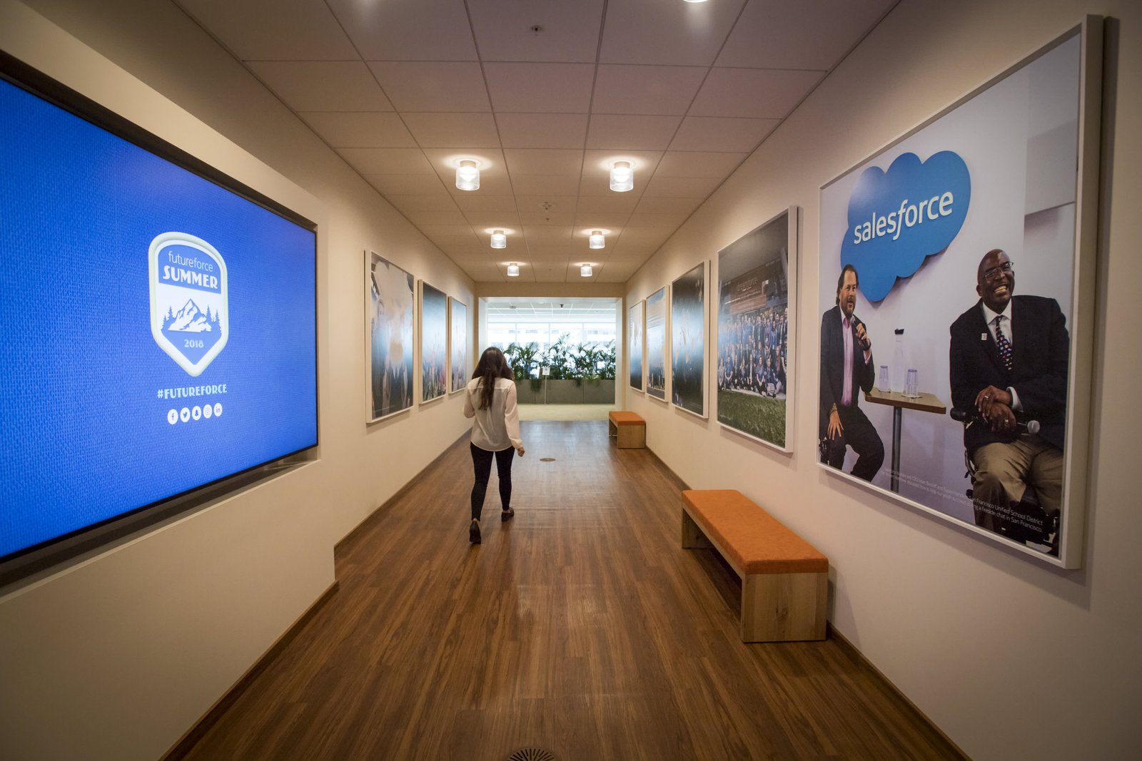 An employee walks through a hall inside the Salesforce.com Inc. office at the new Salesforce Tower in San Francisco, California, U.S., on Tuesday, May 22, 2018. The building, the tallest office tower west of the Mississippi river, opened with a ceremony crowded with local officials on Tuesday, representing the indelible mark San Francisco's largest private employer has made on the city. Photographer: David Paul Morris/Bloomberg via Getty Images