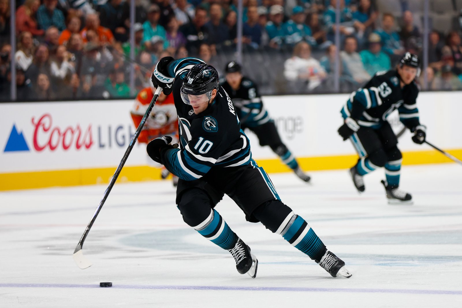 San Jose Sharks' Klim Kostin (10) skates with the puck against the Anaheim Ducks during the first period at the SAP Center in San Jose, Calif., on Saturday, Oct. 12, 2024. (Shae Hammond/Bay Area News Group)