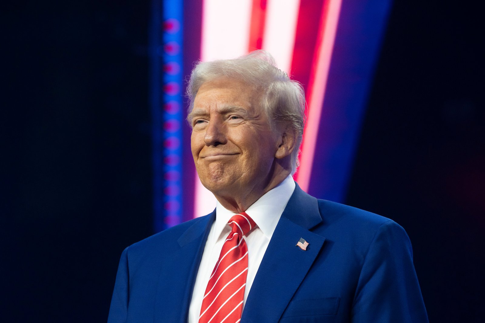 U.S. President-elect Donald Trump smiles during Turning Point USA's AmericaFest at the Phoenix Convention Center on December 22, 2024 in Phoenix, Arizona. His net worth fluctuated heavily during 2024