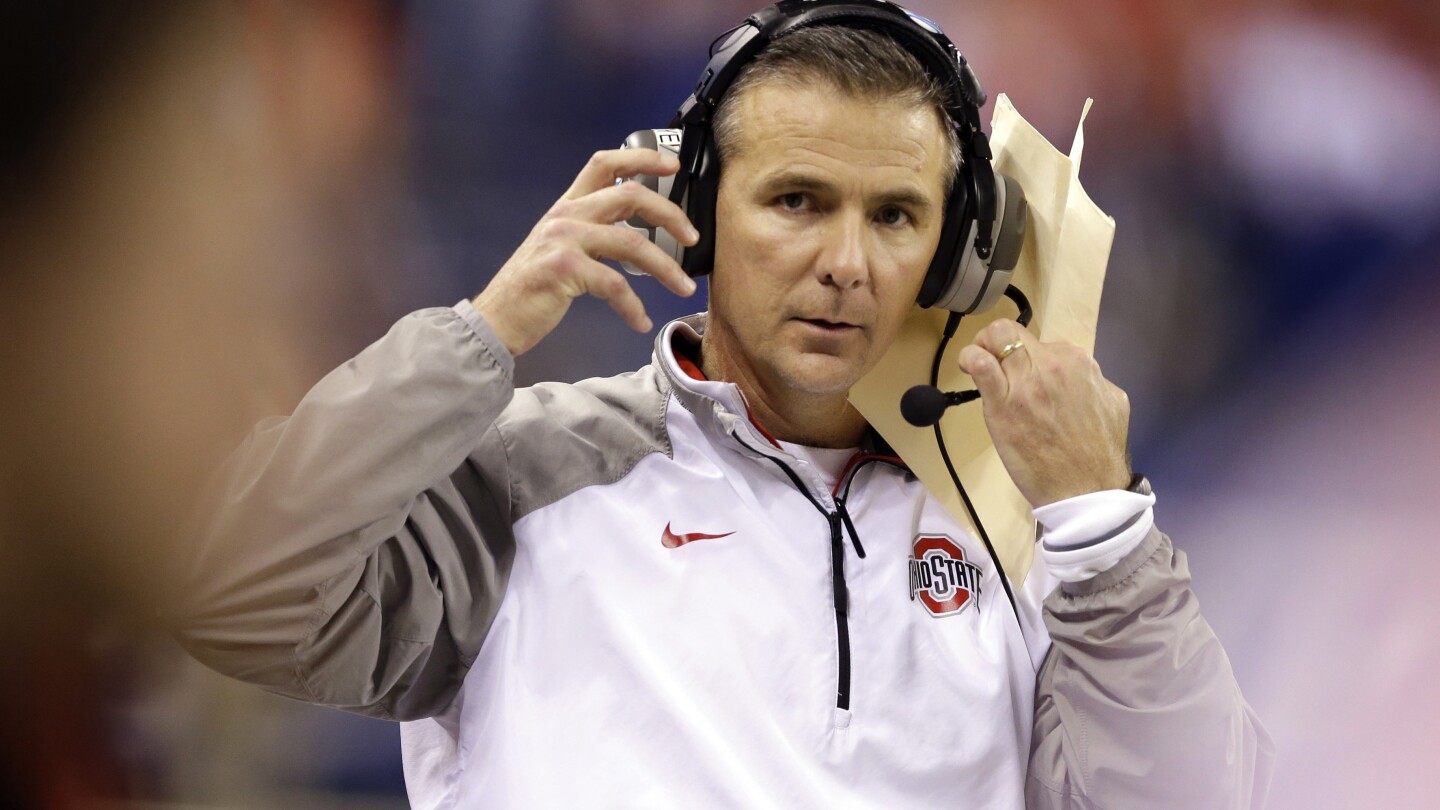 urban-meyer-joins-nick-saban-in-college-football-hof’s-class-of-2025;-vick,-strahan-also-elected