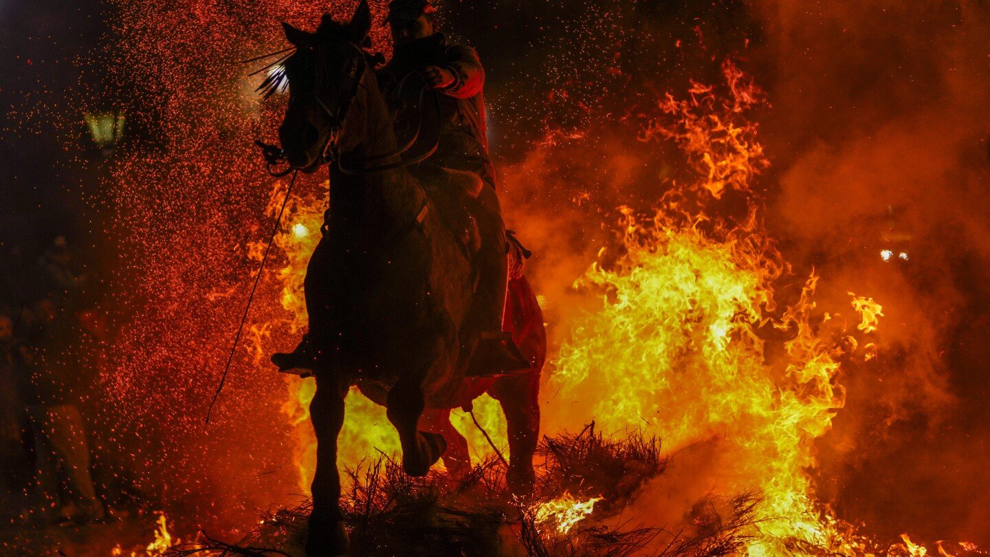 ap-photos:-in-spanish-village,-horses-leap-through-flames-in-centuries-old-ritual