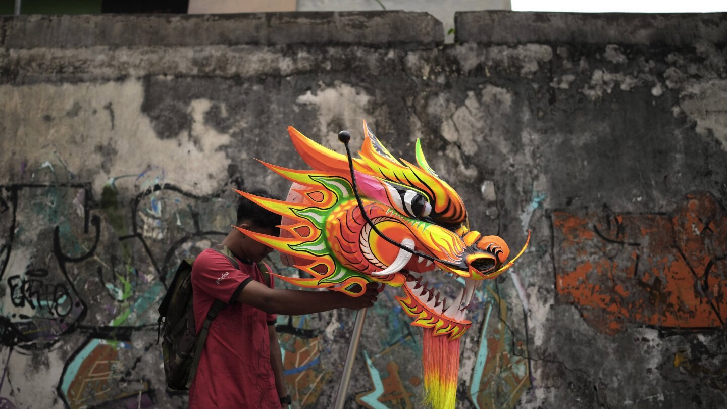 ap-photos:-indonesia-welcomes-the-year-of-the-snake-with-dragon-puppets-and-drum-displays