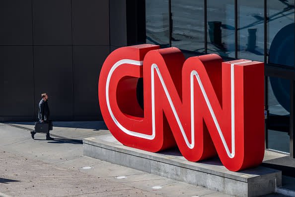 A person walks past the headquarters of CNN in Atlanta, Nov. 17, 2022.