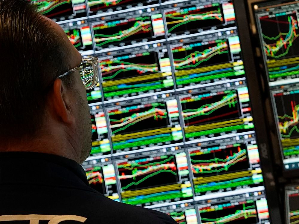 A trader works at his desk on the floor of the New York Stock Exchange (NYSE) during the first session of the new year on January 2, 2025, in New York City. (Photo by TIMOTHY A. CLARY / AFP) (Photo by TIMOTHY A. CLARY/AFP via Getty Images)