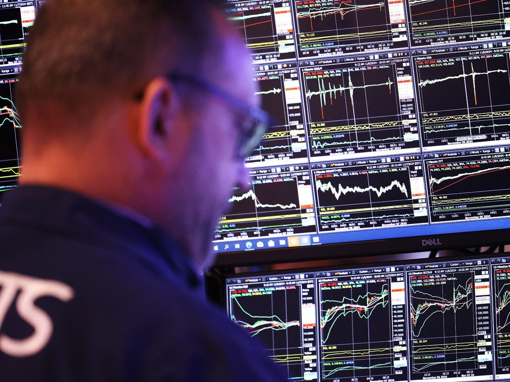 Traders work on the floor of the New York Stock Exchange during the morning trading in New York City. 