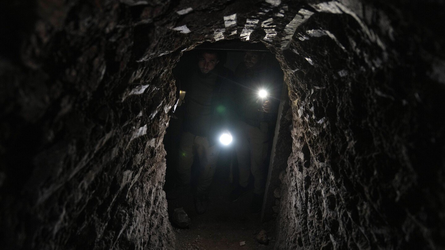 ap-photos:-syrians-returning-to-the-town-of-tel-rifaat-find-homes-in-ruins-and-underground-tunnels