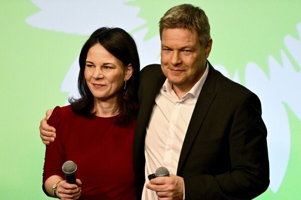 German Foreign Minister Annalena Baerbock, left, and the top candidate Robert Habeck attend the election party of the Greens (Buendnis 90/Die Gruenen) in Berlin Germany, Sunday, Feb. 23, 2025.(Fabian Sommer/dpa via AP)