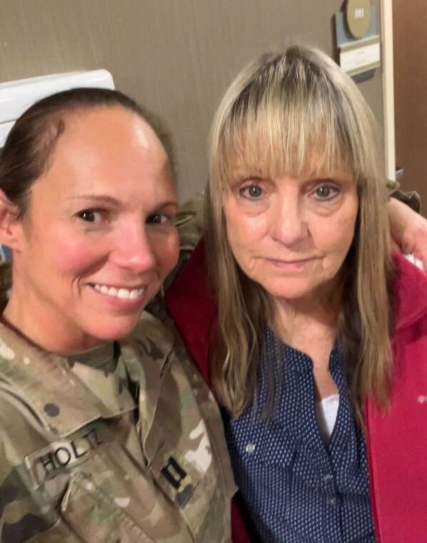 National Guard Capt. Jill Holtz takes a selfie with Violet Vardiman in Black Mountain, N.C., on Wednesday, Nov. 13, 2024. Holtz was helping with recovery efforts following Hurricane Helene when Vardiman told her of what she’d lost, launching Holtz on a mission to reunite residents with keepsakes they thought they’d lost forever. (Jill Holtz via AP)