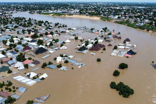 FILE - Houses and buildings are partially submerged following a dam collapse in Maiduguri, Nigeria, Sept 10, 2024. (AP Photos/ Musa Ajit Borno, File)