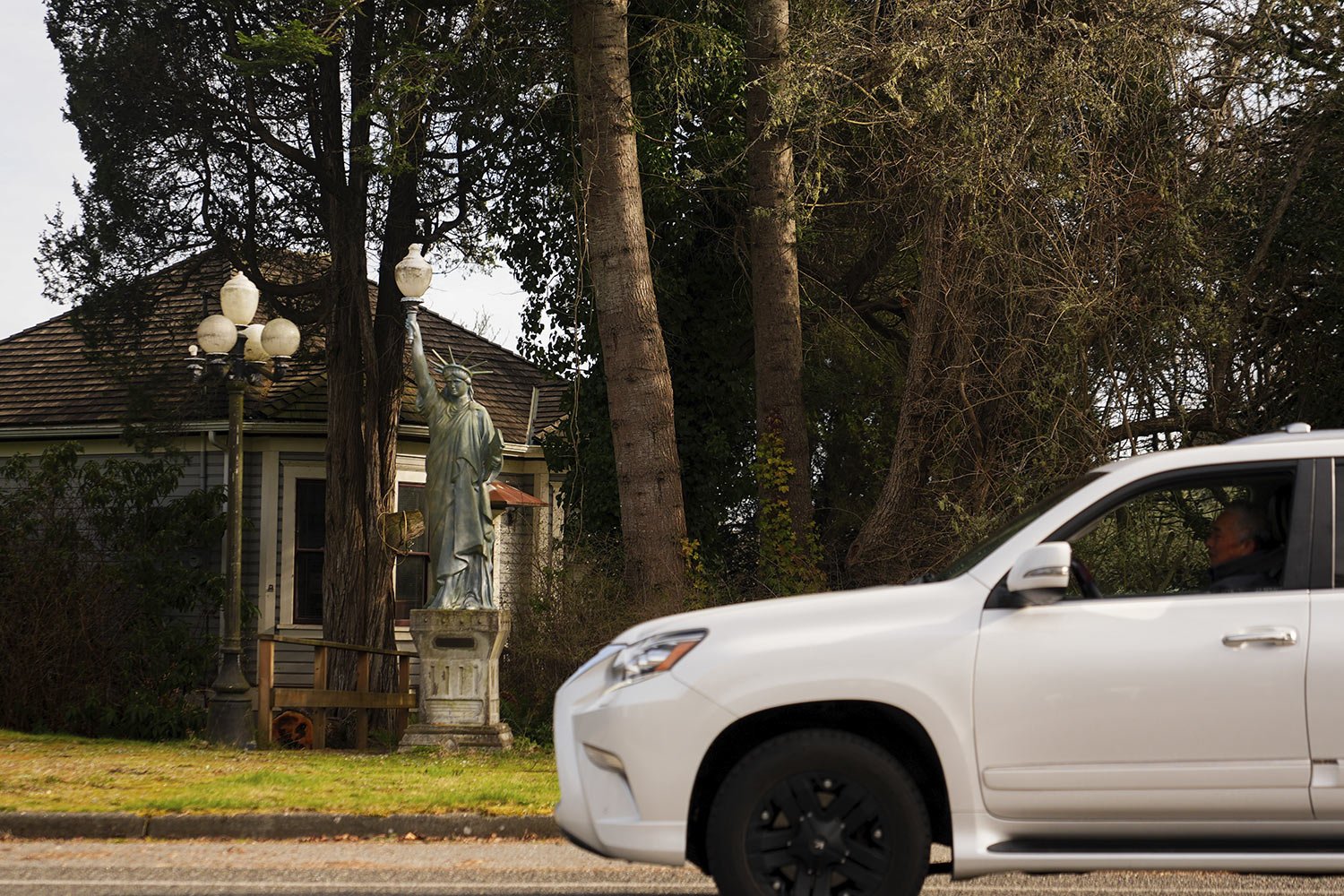 small Statue of Liberty replica outside a home