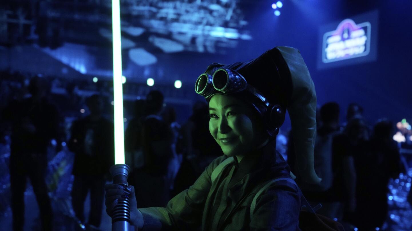 ‘star-wars’-fans-wave-lightsabers-as-an-upcoming-film-gets-announced-in-japan