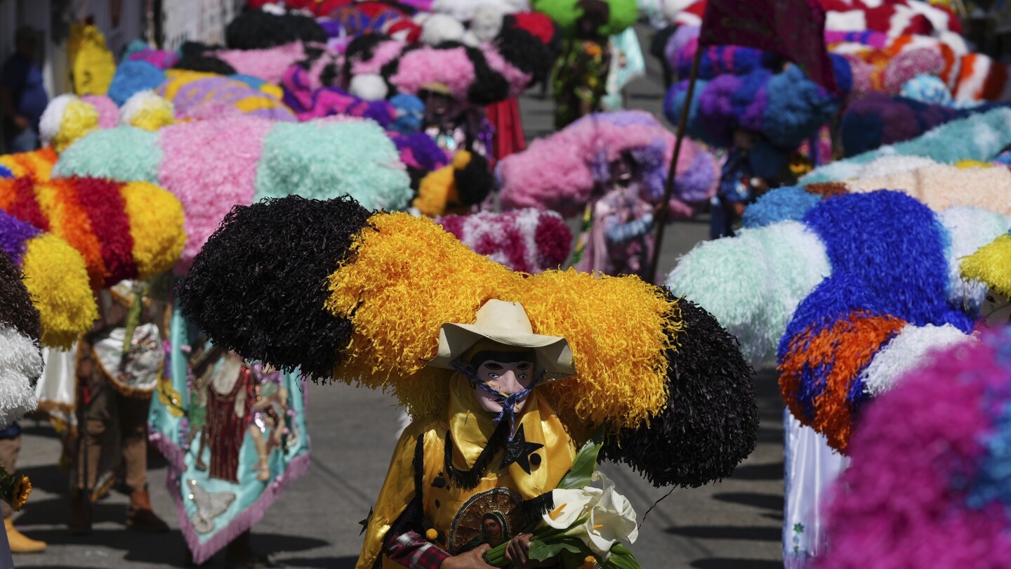 easter-is-celebrated-with-giant-caterpillar-like-hats-and-flames-in-this-mexican-town