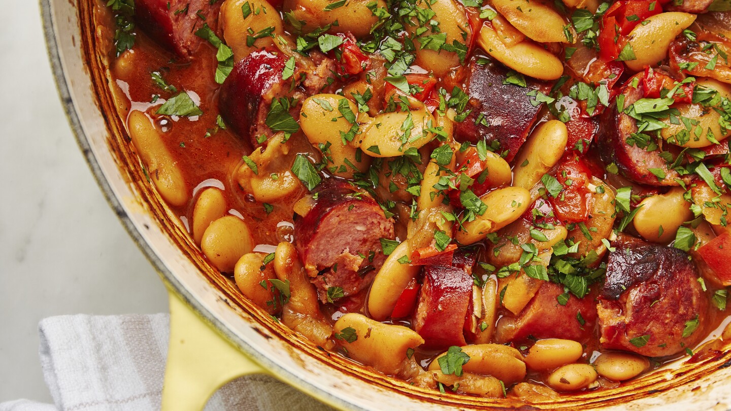 this-rustic-dish-of-baked-beans-and-smoked-sausages-is-packed-with-deep,-aromatic-flavors