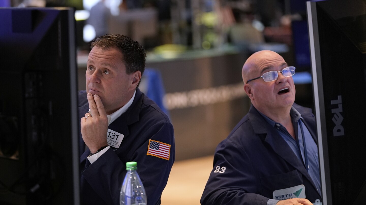 ap-photos:-us-stocks-sink-after-a-weak-report-on-the-economy