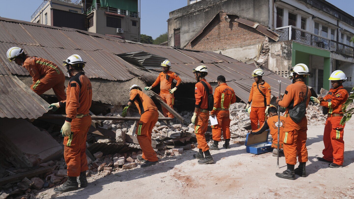 a-woman-is-rescued-from-rubble-in-myanmar-but-hope-is-fading-for-more-quake-survivors