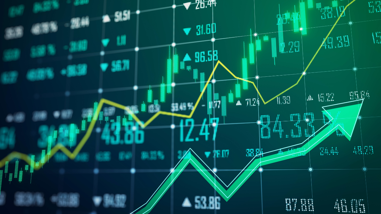 Green stock market numbers with an arrow trending up